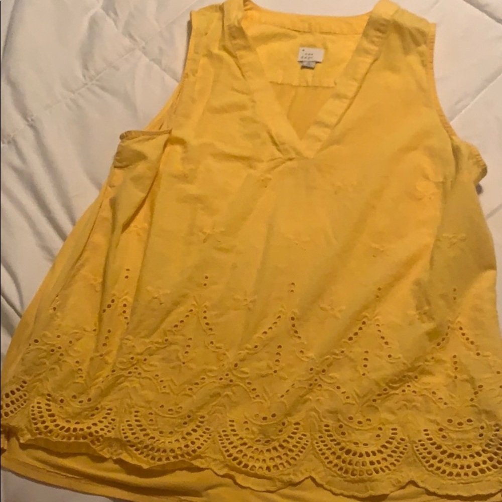 Yellow sleeveless blouse